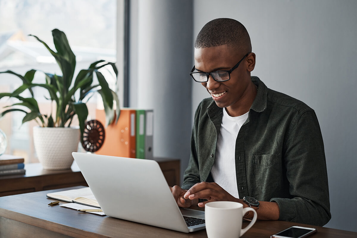 Entrepreneur reviews a balance sheet at his desk