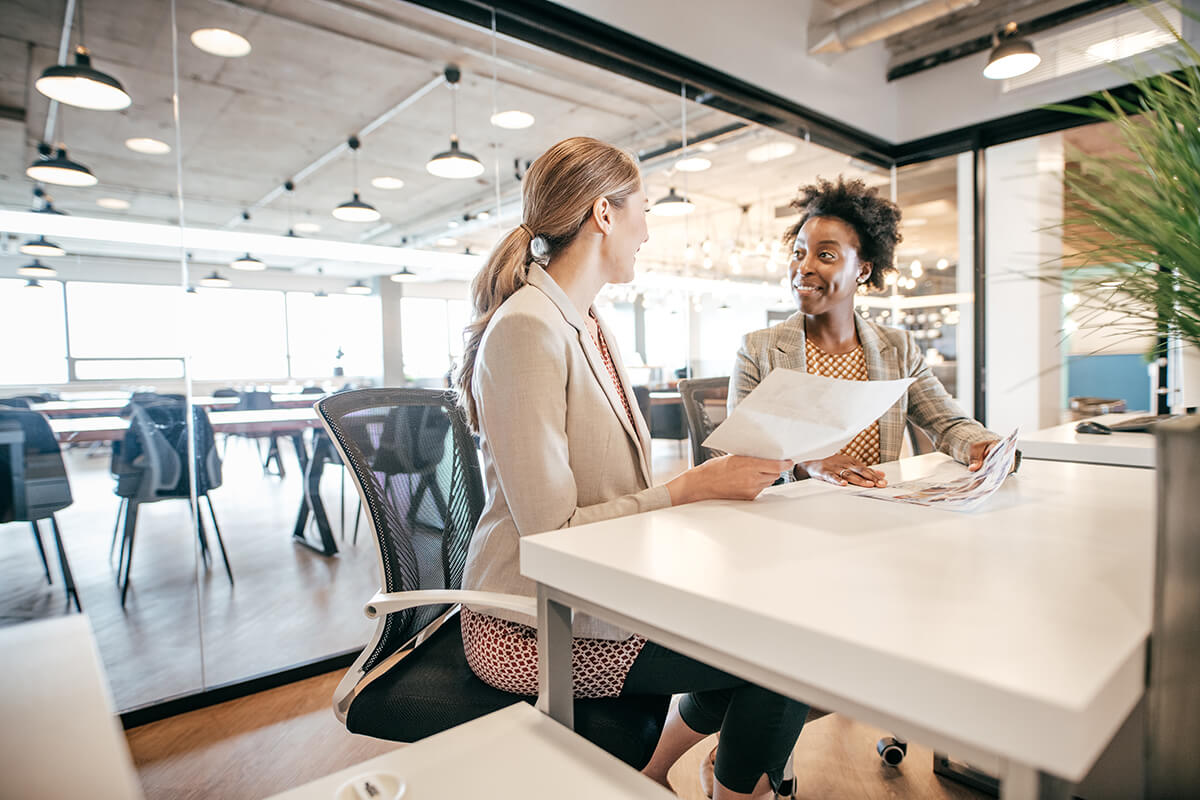 Accountant advises a small business client in office